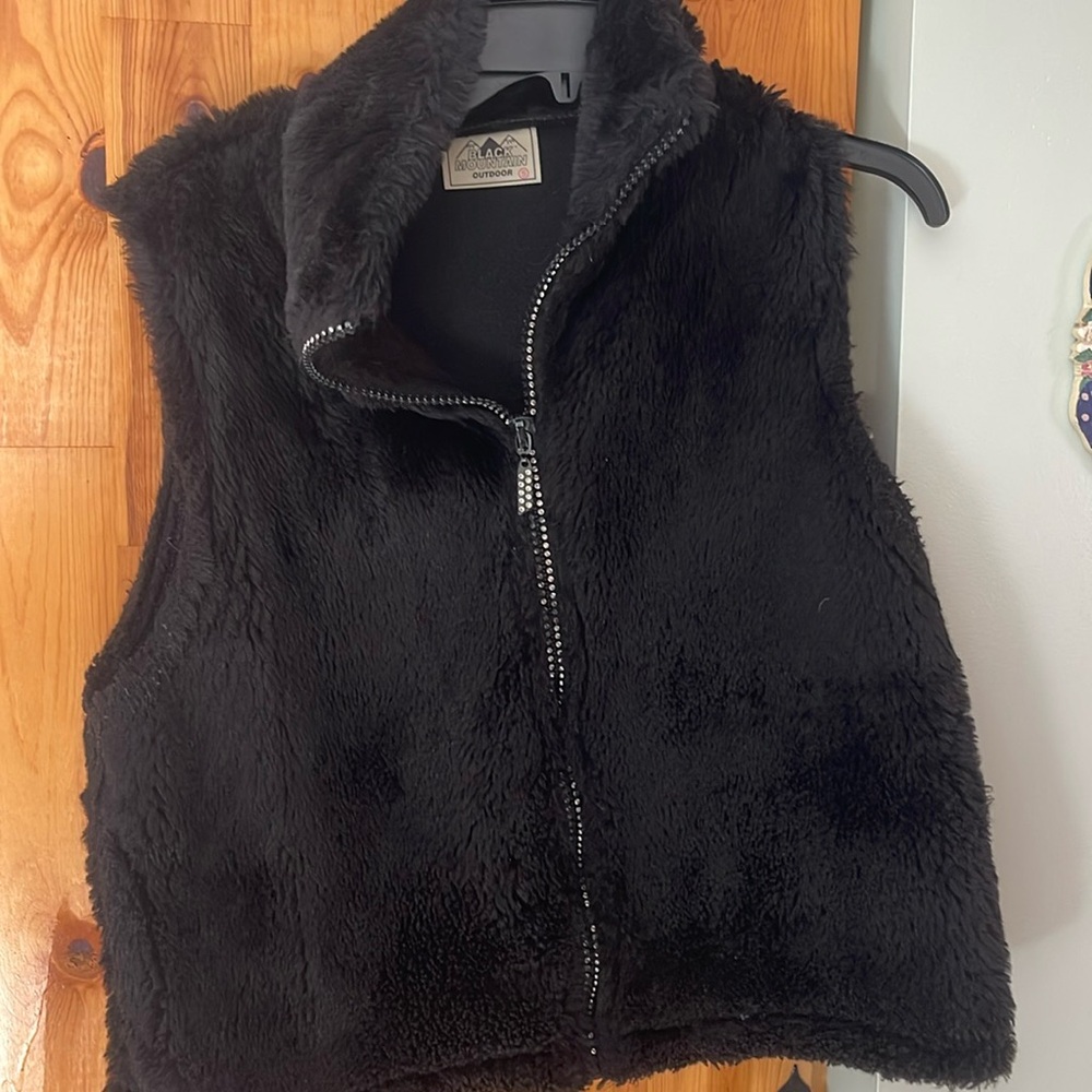 Very cute Black Vest! With studs on the zipper! Keeps you very warm!